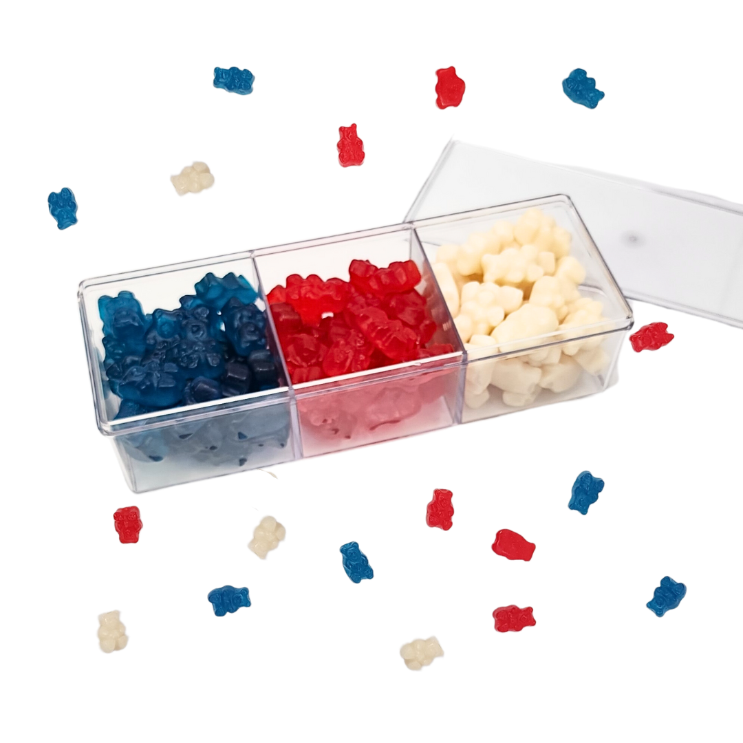 clear divided container with blue red and white gummy bears
