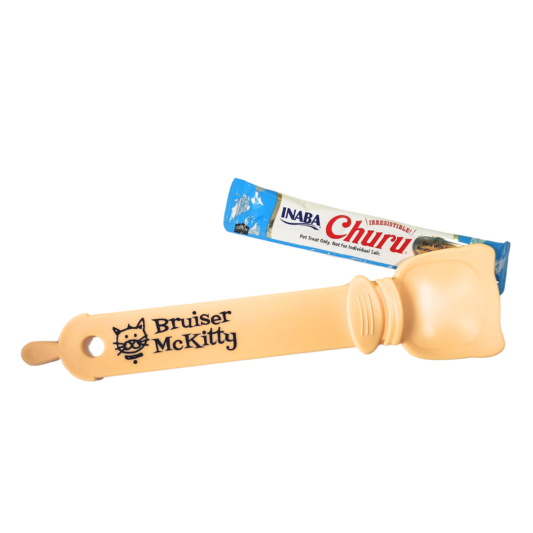 bruiser mckitty logo treat spoon in sunshine yellow color with a churu tube