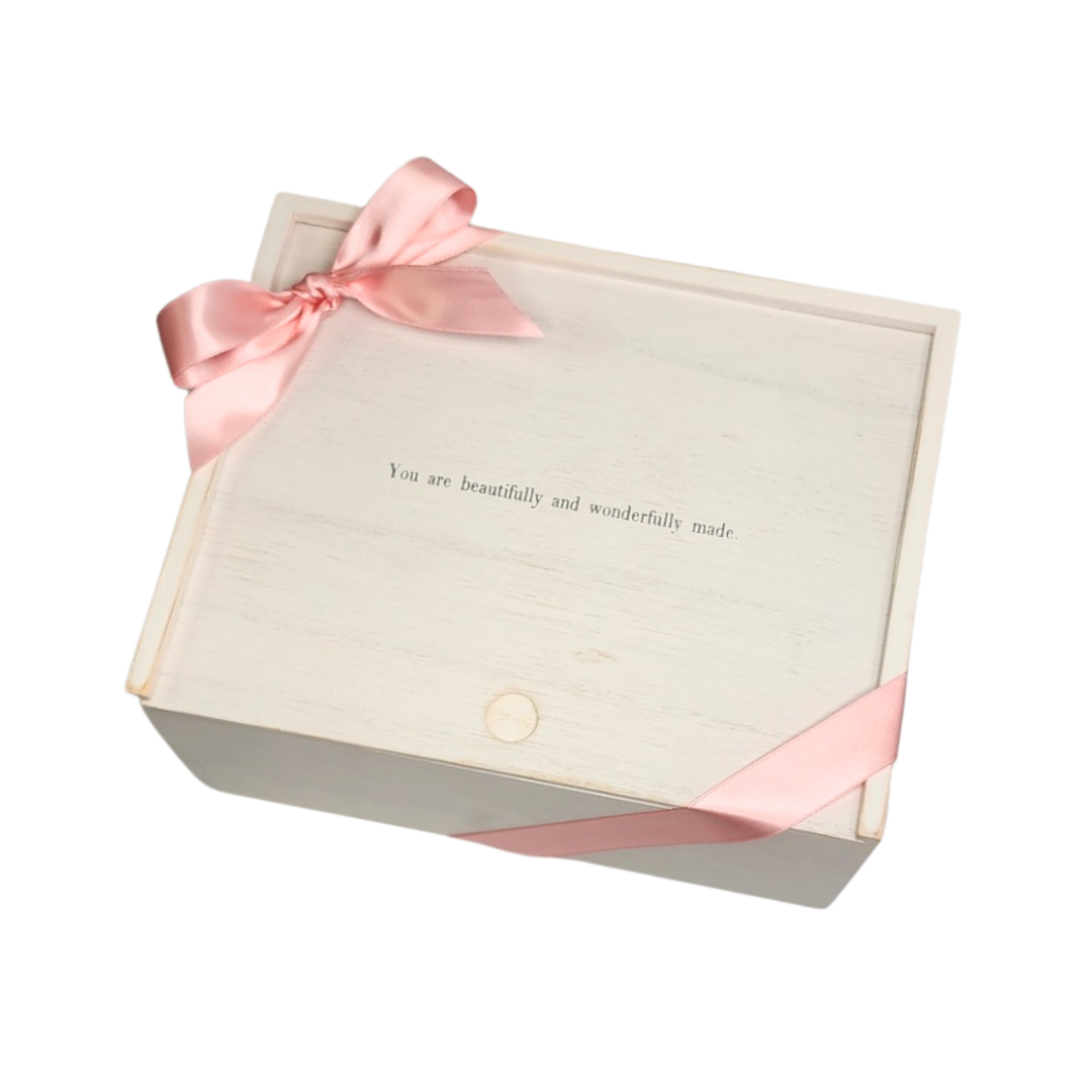 white slider box with pink ribbon and bow