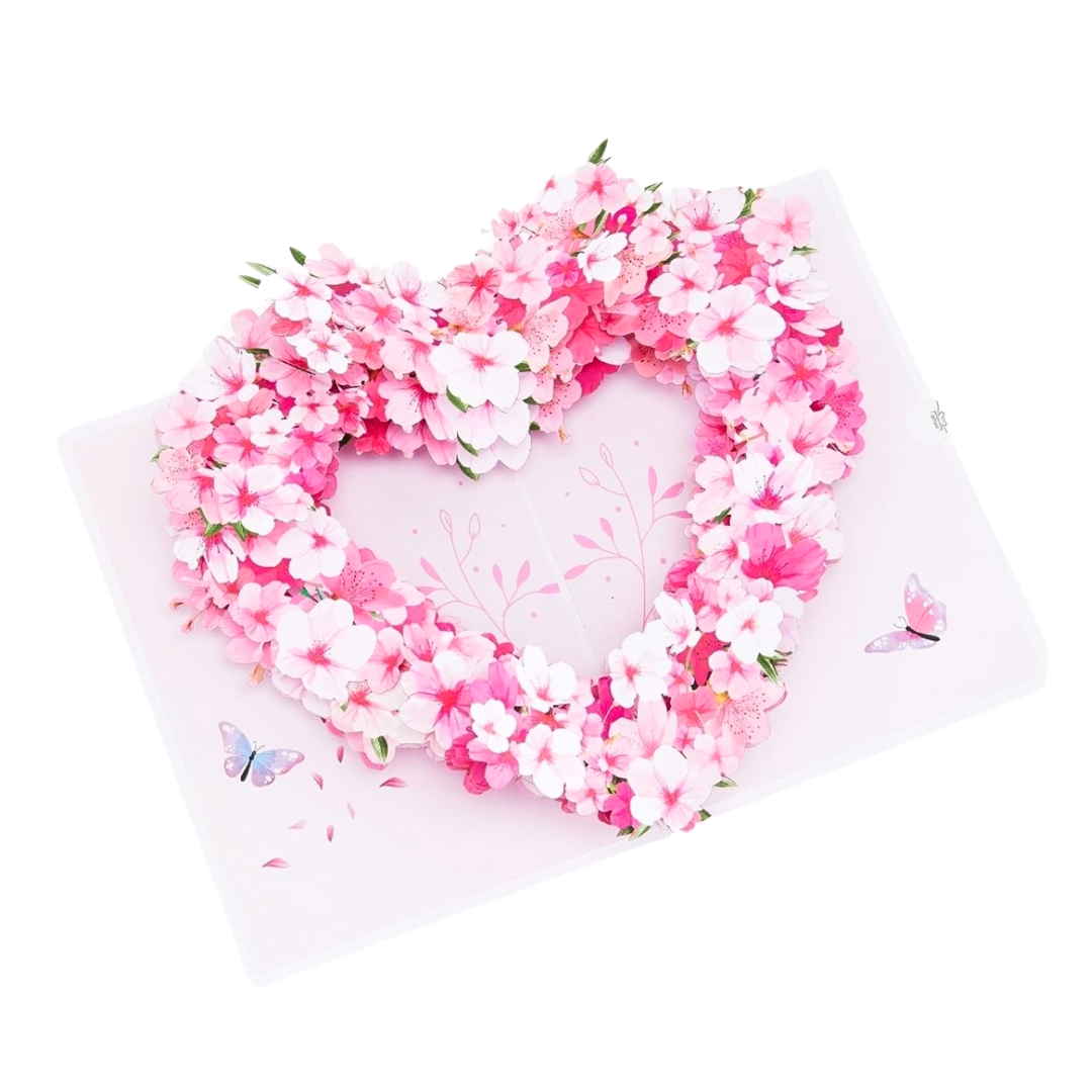 interior view of pop out greeting card with pink and white cherry blossoms arranged in a heart