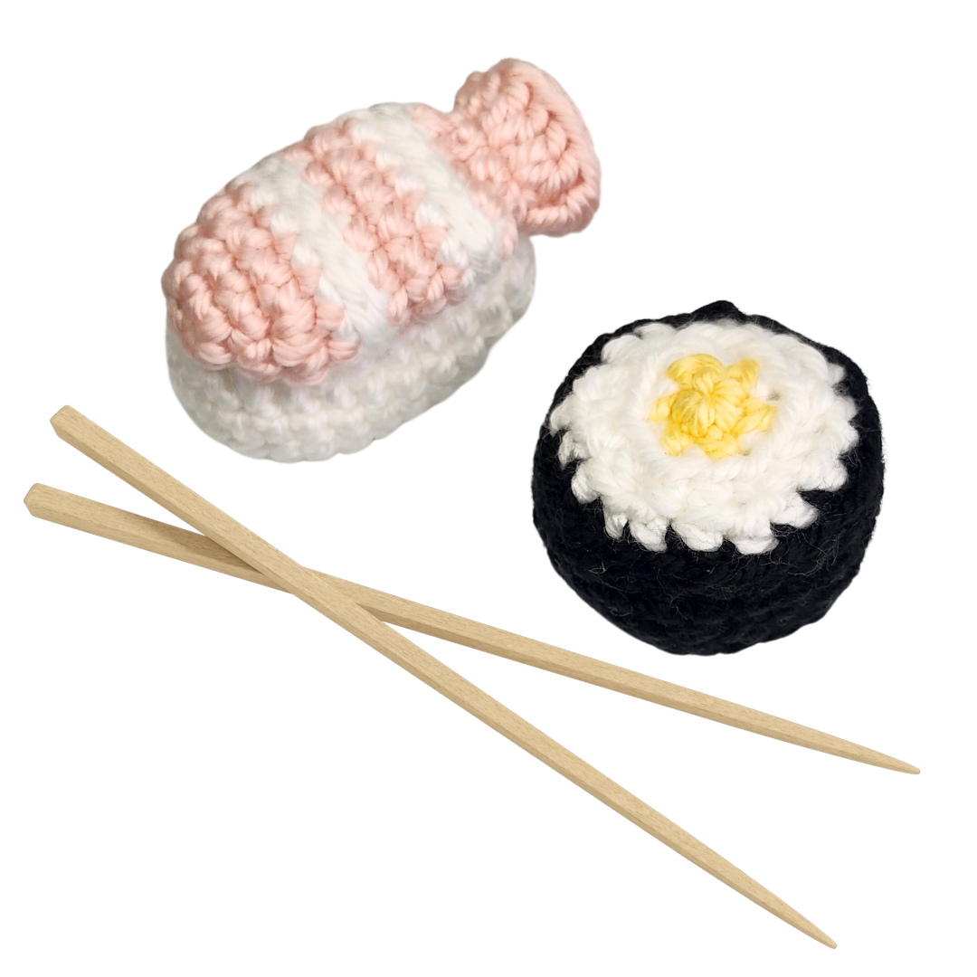 crocheted cat toys in the shapes of nigiri sushi and nori maki