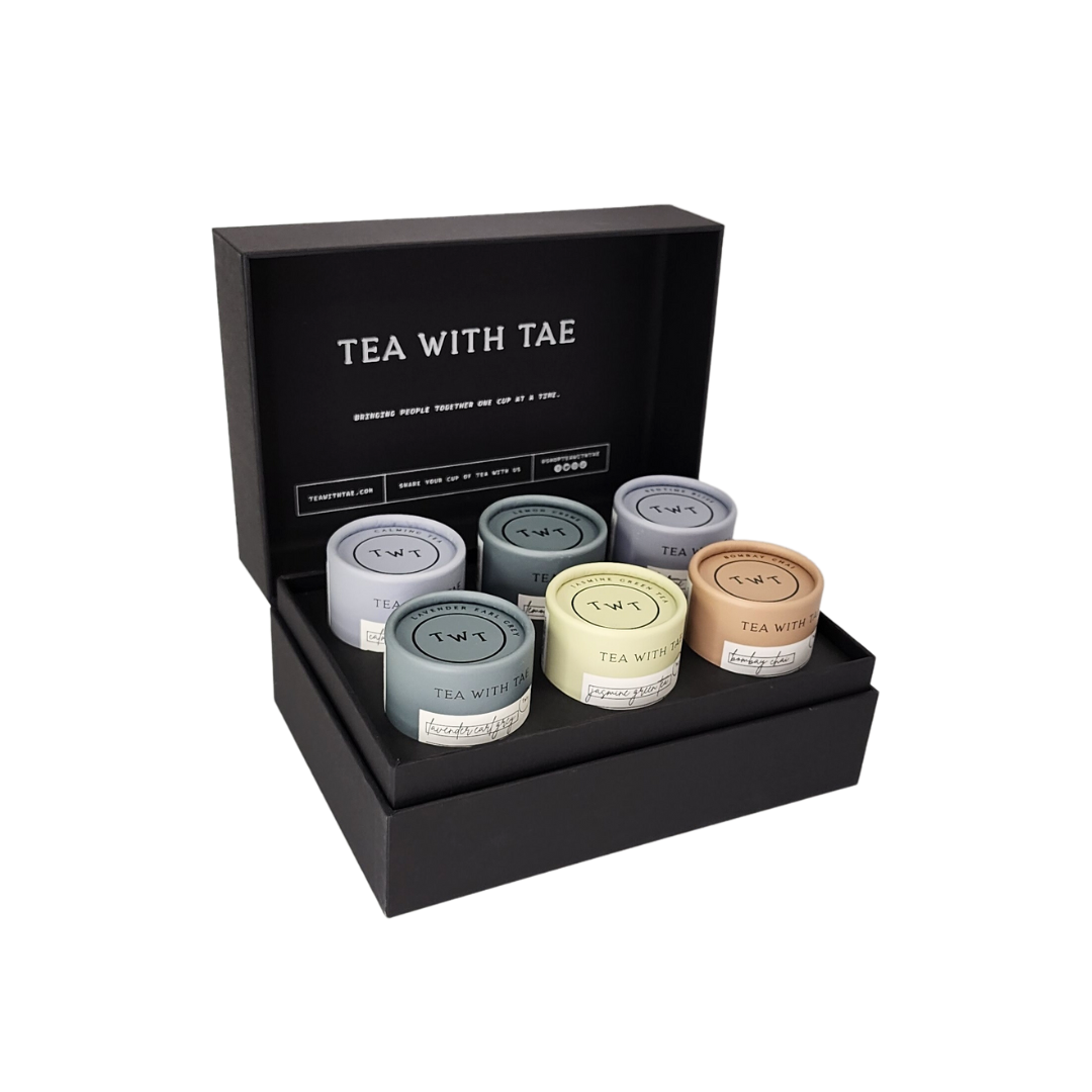 open black box with six tea tubes containing five pyramid tea satchets
