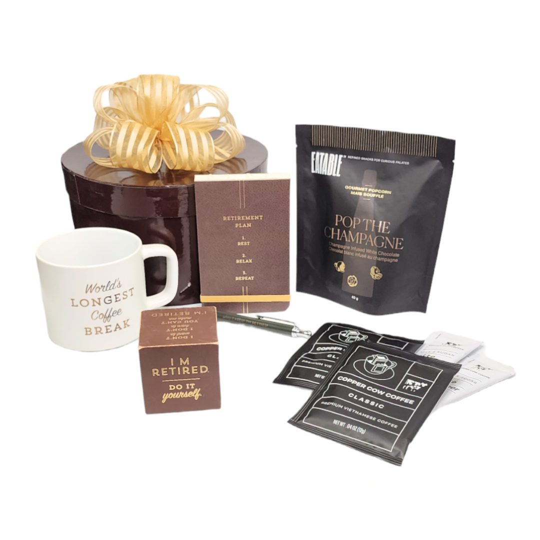 retirement gift with mug, notepad, pen popcorn, quote cube and coffee with creamers