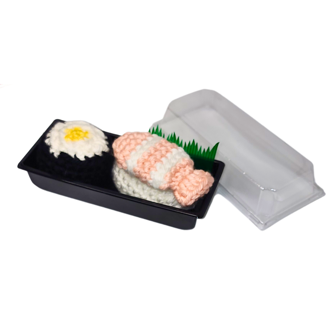 SUSHI CATNIP TOYS, SET OF 2, featuring crocheted salmon nigiri and nori maki filled with organic catnip, displayed in a black tray.