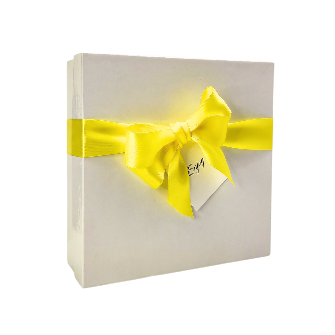 DO WHAT MAKES YOU HAPPY GIFT SET in a white box with yellow ribbon, featuring a journal and assorted lemon-themed snacks.