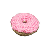 Crocheted donut catnip toy with pink frosting, made for cats. Contains organic catnip and silver vine blend. Durable and handmade, supports cat rescues.