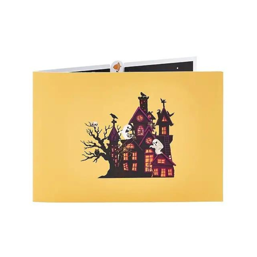 Haunted House Pop Up Card featuring a spooky house with ghosts, perfect for Halloween celebrations. Includes a blank note card for personal messages.