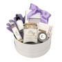 Lavender Serenity Spa Gift: A curated set featuring lavender soap, bath salts, body lotion, spa gloves, and a candle, elegantly packaged in a white box with a bow.