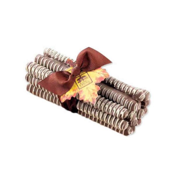 Long Grove Milk Chocolate Pretzel Bundle, featuring a stack of 13 cello-wrapped, chocolate-coated pretzels with a coordinating ribbon and fall leaf tag.