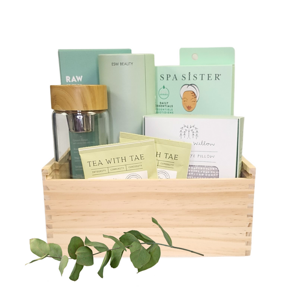 ME TIME RELAXATION SPA GIFT: A wooden box featuring a jade roller, bath pillow, tea infuser, facial masks, and more for a soothing self-care experience.