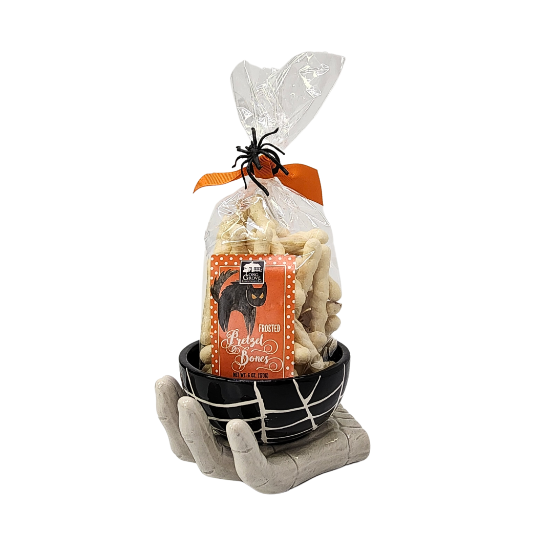 Spooky Skeleton Hand Bowl Candy Gift featuring Long Grove Frosted Pretzel Bones in a ceramic skeleton hand bowl, perfect for Halloween treats.