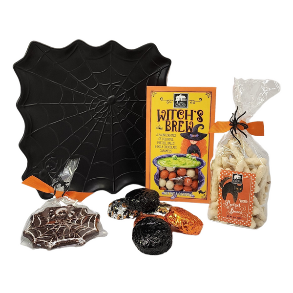 WEB OF TREATS HALLOWEEN SWEETS GIFT: Black tray featuring a spider web platter with assorted gourmet chocolates and candies, perfect for spooky celebrations.