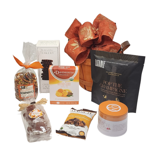 WELCOME FALL SWEET GIFT BASKET featuring assorted chocolates, candies, and popcorn, neatly arranged with a festive bow and tea box, perfect for autumn gifting.