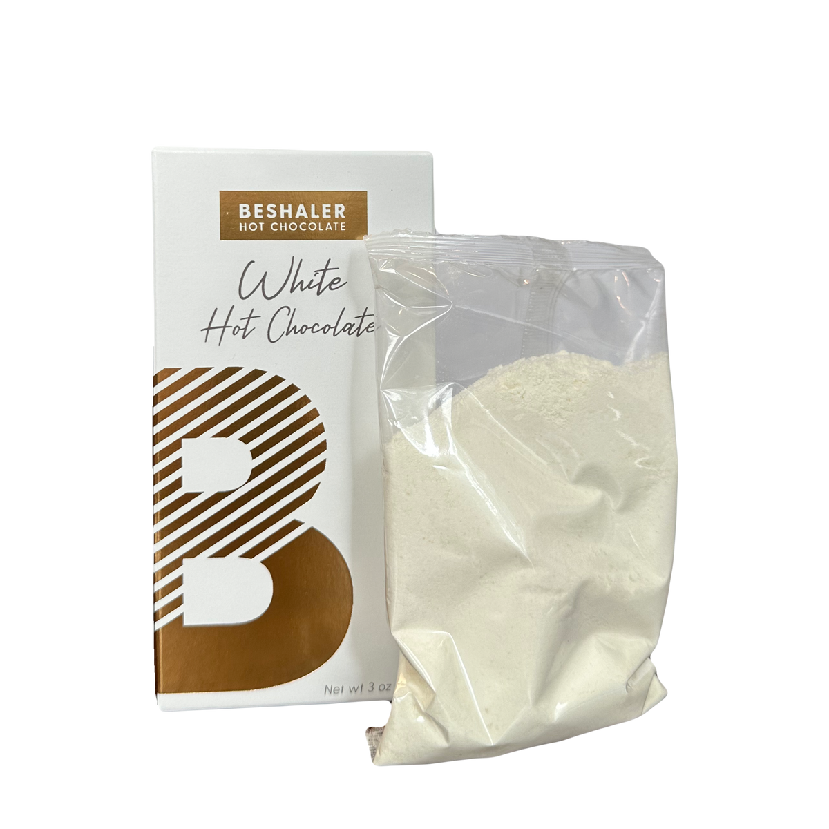 White Hot Chocolate in a bag beside a white and gold package, showcasing a creamy mix for indulgent cups of hot cocoa.